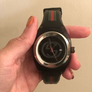 Men’s sync Gucci watch.